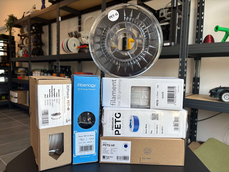 PETG filament spool with boxed filament from several brands