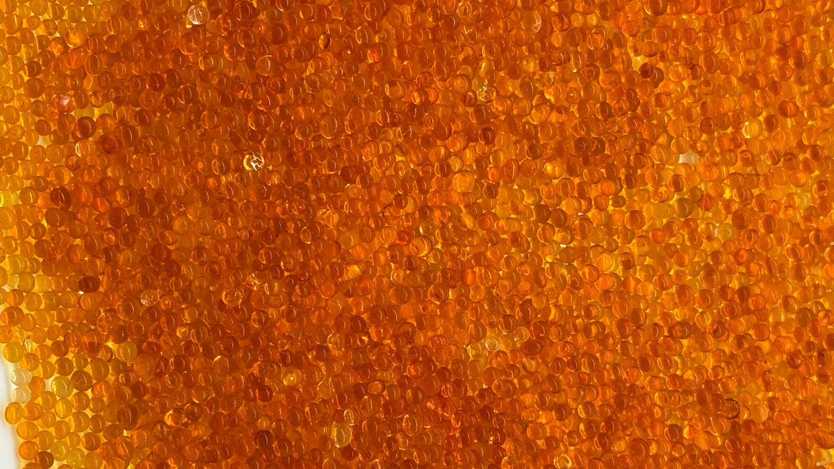 Close-up of orange indicating silica gel beads